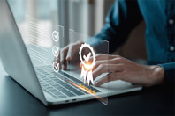 Digital Transformation And Quality By Design For Enhanced Development GettyImages-1904641522-laptop-hands-ribbon-digital