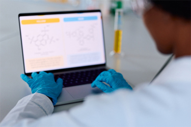 GettyImages-2261840472-scientist-computer-in-lab-chemical-equations-on-screen