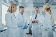 Overcome Single-Use Customization Misconceptions Scientist lab discussion meeting GettyImages-1140779742
