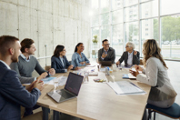 Document Review Integrations And Technology Partners GettyImages-1987101391-table-office-business-professionals-documents-laptops