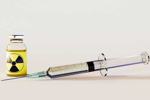 Radioactive intravenous drug using syringe-GettyImages-2064405956