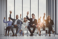 Lessons For Outsourcing: Can You Pass The Test? Group-raising-hands-GettyImages-1008913110