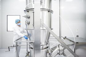 South Haven cGMP Manufacturing Services And APIs GettyImages-1417396515 Pharmaceutical Technician In A Manufacturing Facility