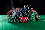 Lonza Bets On Biologics. What's It Mean For You? businessman oushing gambling chips-GettyImages-1423256250