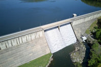 Reservoir spillway dumping overflow-GettyImages-2152233125