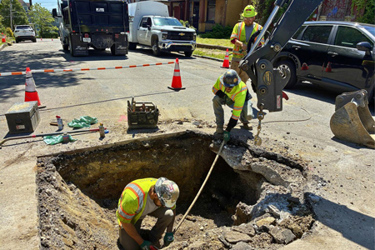 Contractors preparing to remove a lead service line in Polish Hill Contractors preparing to remove a lead service line in Polish Hill
