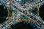 Drone Point View of Overpass and City Traffic at Night-GettyImages-1279832748