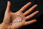 Question-Pills-Hand