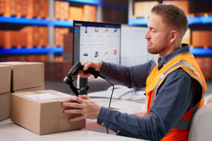 warehouse worker checking barcodes-GettyImages-2265704054