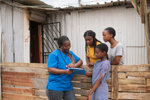 community nurse with three teens-GettyImages-1442937688
