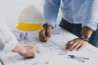 GettyImages-1330168130-facility-design-blueprint-planning-construction