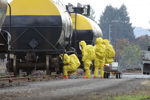 HAZMAT Team Members Checks For LeaksiStock-177036592