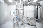 GettyImages-1417391937-pharmaceutical-spray-drying-with-scientists