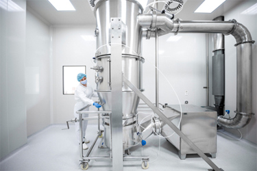 GettyImages-1417391937-pharmaceutical-spray-drying-with-scientists