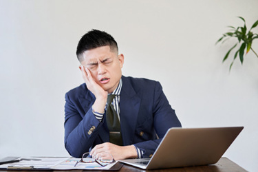 Asian businessman Worried GettyImages-1308380823