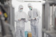 GettyImages-1344379539-manufacturing-men-holding-tablet