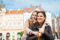 EU - young girl and mother in town square 2 (high res)