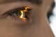 Light beam shining in eye, eye exam-GettyImages-1398519163