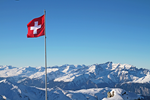 Switzerland-Swiss-Flag-Alps-iStock-1073386184