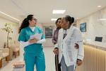 Grandmother-and-adult-granddaughter-speak-with-HCP-in-clinic-2-(high-res)-(1)