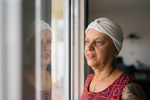 Elderly oncology patient at her window (high res)