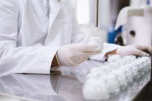 GettyImages-947660782-healthcare-liquid-medicinal-filling-scientist-in-lab-coat