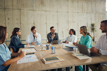 Group of doctors in meeting-GettyImages-2169868459