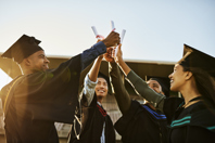 Outsourcing Needs More MBAs (Yes, You Read That Correctly) Group of graduates-GettyImages-1406888053