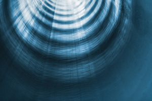 dark blue tunnel with light at end-GettyImages-1306677782