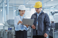 GettyImages-1462148610 Engineers Using Laptop In Factory