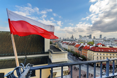 Poland Flag, warsaw background-GettyImages-843008242 Poland Flag, warsaw background-GettyImages-843008242