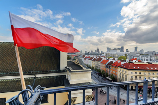 Poland Flag, warsaw background-GettyImages-843008242
