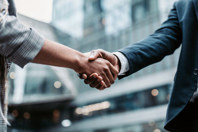 GettyImages-1916729901-two-business-men-deal-handshake