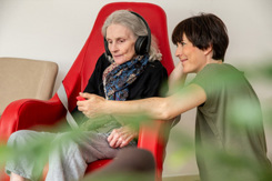 senior woman headphones music-GettyImages-1541079735