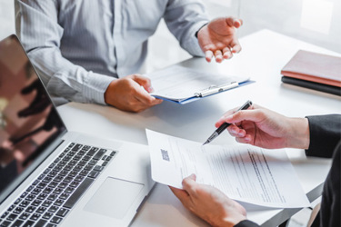 GettyImages-1198993506-team-meeting-laptop-paperwork-decision GettyImages-1198993506-team-meeting-laptop-paperwork-decision