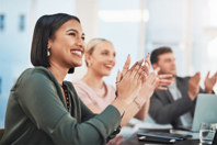 GettyImages-1389923236-woman-clapping-office-celebrate