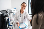 HCP speaking with a patient in an exam room (high res) (1)