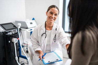 HCP speaking with a patient in an exam room (high res) (1)