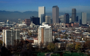 A classic example of fossil fuel emission. Trapped by an inversion, a thick blanket of pollution, or brown cloud, hangs in the distance over Denver, Colorado. Photochemical smog, as the brownish-yellow haze is called, results from the action of sunlight on nitrogen oxides (formed by internal combustion engines) and hydrocarbons (gasoline vapors that escape unburned).

Credit: Copyright University Corporation for Atmospheric Research