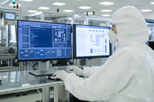 Quality Risk Management Software GettyImages-1087218944 Scientists In Sterile Suits Working With Computers In The Laboratory