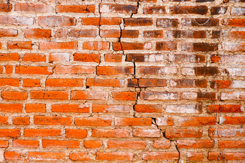 cracked brick wall-GettyImages-1449964933