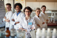 Pharma Analysis & Quality Control: Trends From The Rapid Pharma Evolution Group of young laboratory technicians in the lab-iStock-1310904878