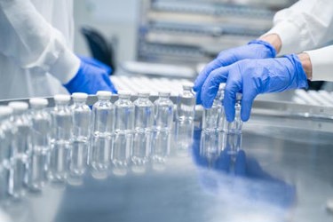 hands working in pharmaceutical laboratory-GettyImages-2173467866 hands working in pharmaceutical laboratory-GettyImages-2173467866