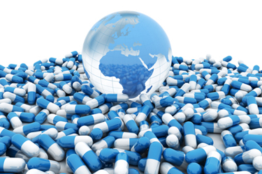 Medicine pills and blue world globe GettyImages-1403039479