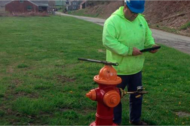 Hydrant Crew Member Recording an Inspection via ArcGIS Collector Hydrant Crew Member Recording an Inspection via ArcGIS Collector