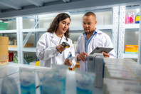 Manager checking expiration dates in drugstore-GettyImages-1666055443