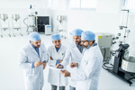 team of scientists in laboratory-GettyImages-1340654609