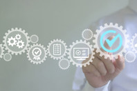 Embracing Pharma 4.0: Why Operational Digitization Must Be The Top Priority GettyImages-1783080169-quality-management-gear-white-lab-coat-hand-digital