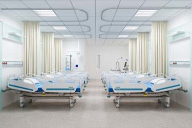 empty hospital beds, clean clinical environment-GettyImages-2267391736 empty hospital beds, clean clinical environment-GettyImages-2267391736