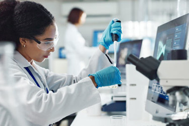 Test tubes, dropper, scientist in lab-GettyImages-2157720330